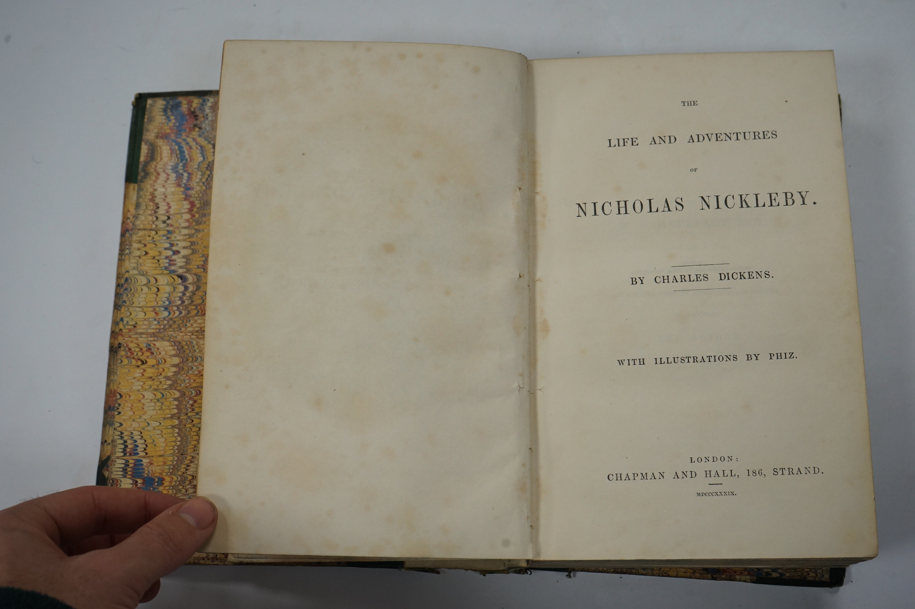 Dickens, Charles - The Life and Adventures of Nicholas Nickleby. First Edition. portrait frontis. of the author, 39 plates (by Phiz, i.e. H.K. Browne); near contemp. half calf and marbled boards, gilt decorated and panel